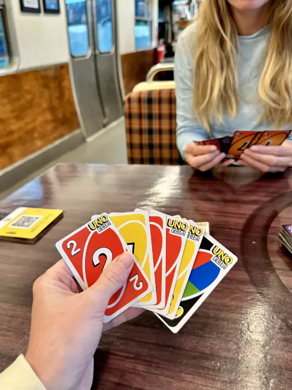 Playing Uno Flip in restaurant whilst traveling