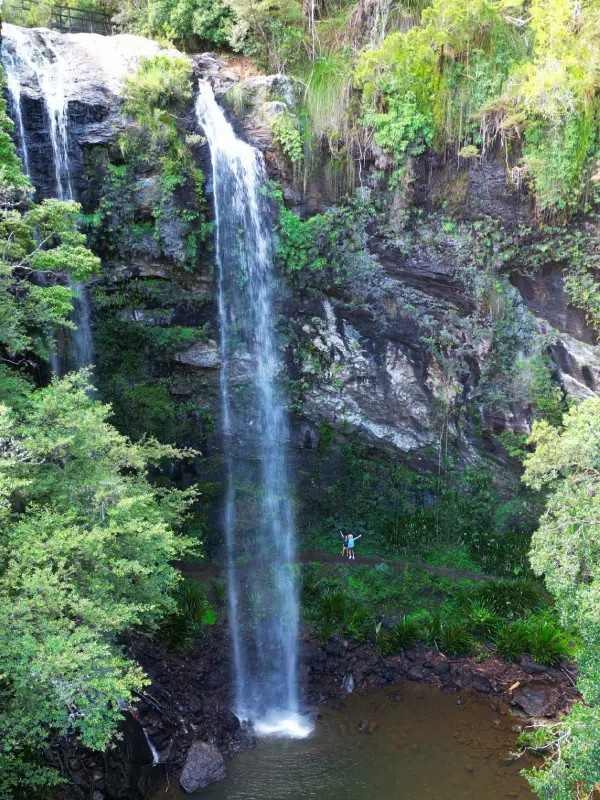 Walking behind the Twin Falls at Springbrook National Park